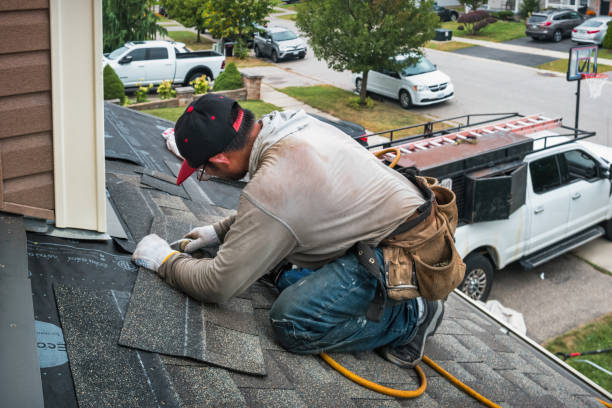Professional Gutter Installation technician working in Wenham, MA